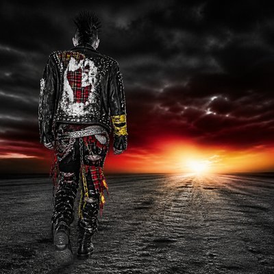 a solitary figure walking toward a glowing horizon across an empty plain, moody atmosphere, no text or lettering