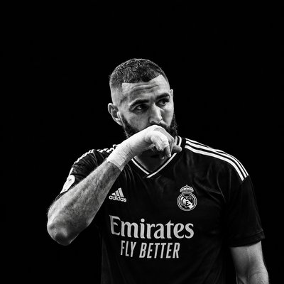 a black and white photo of a soccer player