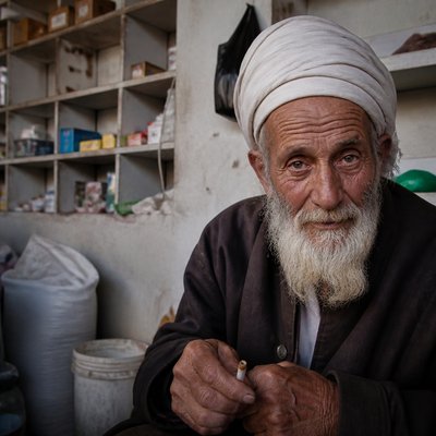 close-up portrait of an elderly person with expressive weathered features