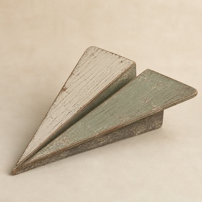 a paper plane, clean minimal composition on a plain background, no text