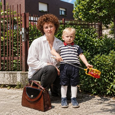 a woman and a child are posing for a picture