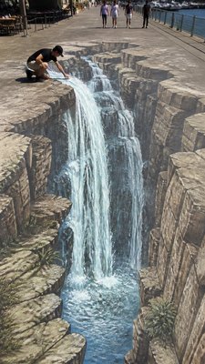 towering waterfall cascading down a cliff
