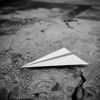 a paper plane, clean minimal composition on a plain background, no text