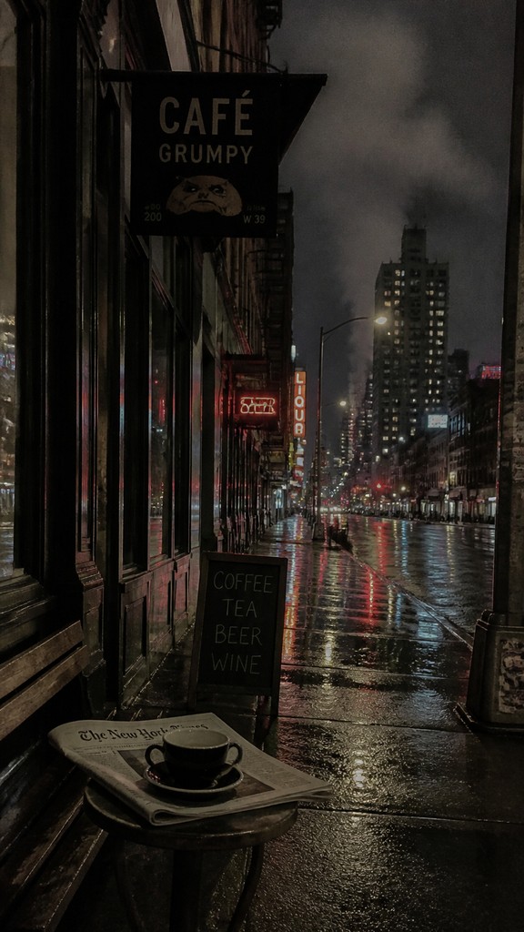 a quiet rainy city street at night reflecting neon signs, no people
