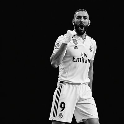 a man in a soccer uniform is making a funny face