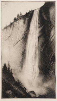 towering waterfall cascading down a cliff