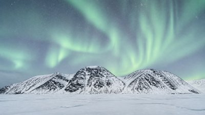 a flowing aurora over snowy peaks, wide sweeping composition, no people, no text