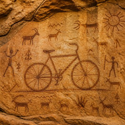 bicyle resting against a wall