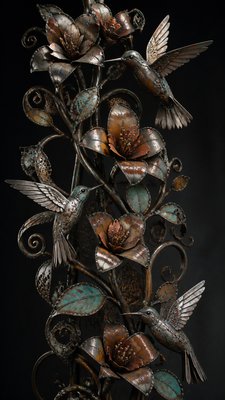 a climbing vine of flowers and hummingbirds on a dark background, tall wrapping composition, no text