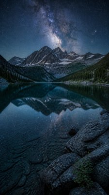 a tranquil mountain lake beneath a starry night sky, no people, no text