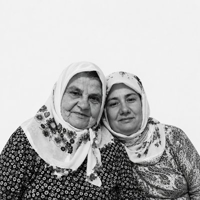 a black and white photo of two women