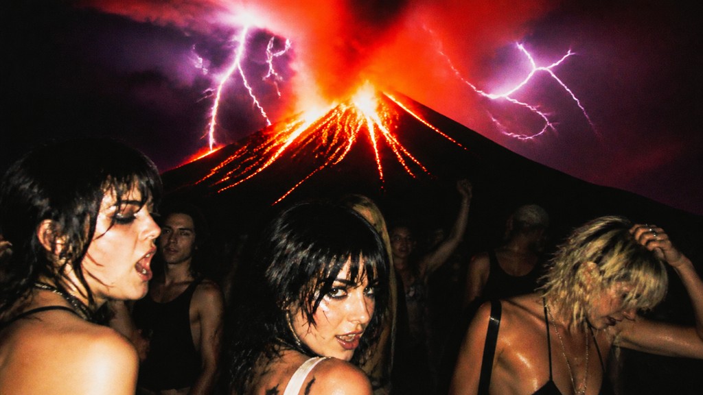 an erupting volcano with lightning strikes, dramatic wide composition, no text