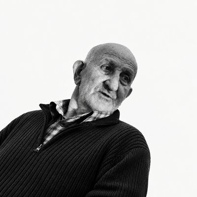 a black and white photo of a man in a sweater