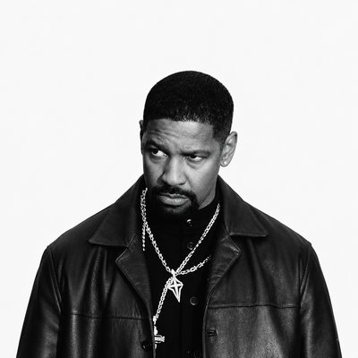 a man in a leather jacket with a chain around his neck