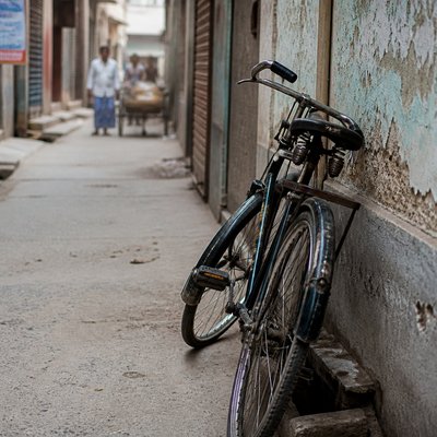bicyle resting against a wall — Documentary Photography Style