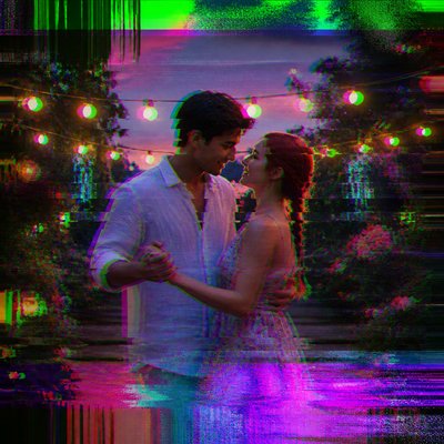 an original couple dancing under string lights in a garden at dusk: a man with short black hair in a linen shirt and a woman with braided red hair in a summer dress