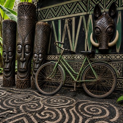 bicyle resting against a wall