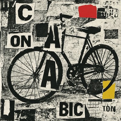 bicyle resting against a wall