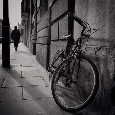 bicyle resting against a wall