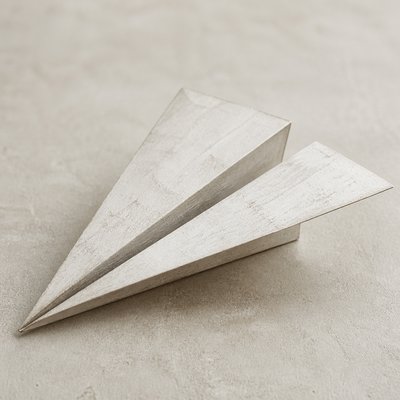 a paper plane, clean minimal composition on a plain background, no text