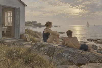 A male and female swimmer rest on a rock by the sea