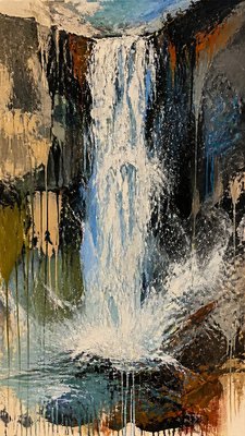towering waterfall cascading down a cliff