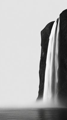 towering waterfall cascading down a cliff