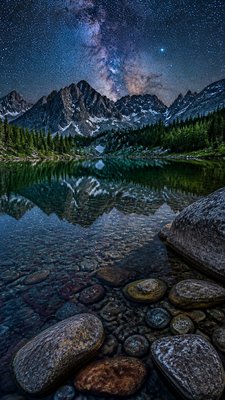 a tranquil mountain lake beneath a starry night sky, no people, no text