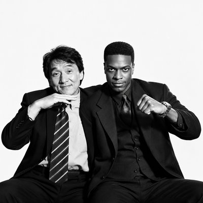 a couple of men sitting next to each other
