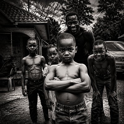 a group of young boys standing next to each other