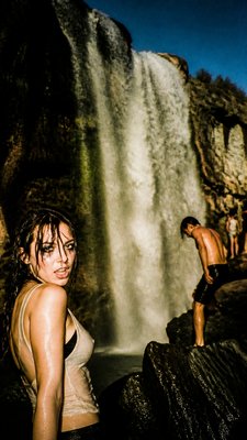towering waterfall cascading down a cliff