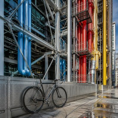 bicyle resting against a wall