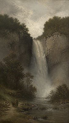 towering waterfall cascading down a cliff