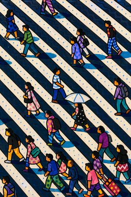 a group of people walking across a cross walk