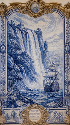 towering waterfall cascading down a cliff