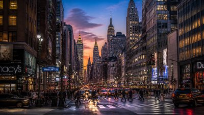 bustling city street panorama at dusk