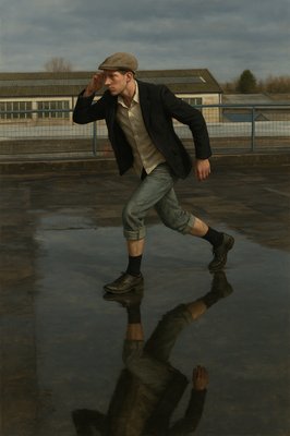 a man is walking in the rain with his reflection in the water